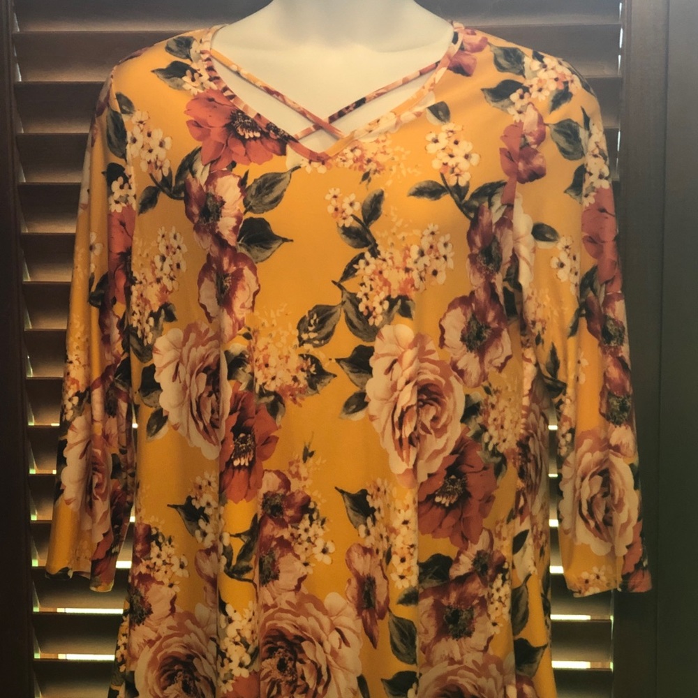 Beautiful yellow floral top with cross straps.